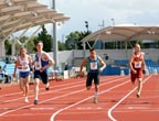 54 Luke Evans (Blackburn) wins the 200 metres from 169 Darren Scott (City of Sheffield), 17 Rick Beardsall (City of Sheffield) and 67 Luke Giblin (Belgrave Harriers), Northern Championships, Sport City, Manchester